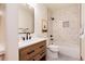 Updated bathroom with floating vanity and shower over tub at 16226 River Haven Way, Morrison, CO 80465
