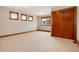 Spacious bedroom with neutral carpet and wood trim at 16226 River Haven Way, Morrison, CO 80465