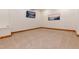 Bonus room with neutral carpet, wood trim and painted walls at 16226 River Haven Way, Morrison, CO 80465