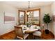 Breakfast nook with round table, natural light and greenery at 16226 River Haven Way, Morrison, CO 80465