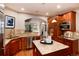 Updated kitchen with granite countertops, stainless steel appliances, and center island at 16226 River Haven Way, Morrison, CO 80465