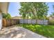 A fenced backyard featuring a grassy area and a concrete patio at 7542 Otis St, Arvada, CO 80003
