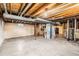 Unfinished basement with exposed utility connections and concrete floor at 7542 Otis St, Arvada, CO 80003