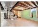 Unfinished basement with exposed ceiling, painted walls and concrete floor at 7542 Otis St, Arvada, CO 80003
