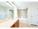 Bathroom with vanity, tub-shower, and tiled floor at 2983 Fulton St, Denver, CO 80238