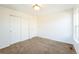 Bedroom with carpet, large closet doors, and ample natural light at 2983 Fulton St, Denver, CO 80238