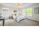 Bright bedroom with a neutral color scheme and multiple windows offering ample light at 2983 Fulton St, Denver, CO 80238