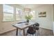 Bright dining area with a modern chandelier and large windows providing natural light at 2983 Fulton St, Denver, CO 80238
