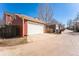 Detached two car garage with alley access and parking pad for additional parking at 2983 Fulton St, Denver, CO 80238