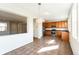 Well-lit kitchen boasts stainless steel appliances, tile floors, and large windows at 2983 Fulton St, Denver, CO 80238
