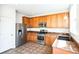 Bright kitchen featuring stainless steel appliances, ample cabinet space, and tile floors at 2983 Fulton St, Denver, CO 80238