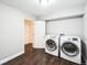 Functional laundry room with modern washer and dryer at 2983 Fulton St, Denver, CO 80238