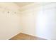 Spacious walk-in closet with wire shelving and neutral carpeting at 2983 Fulton St, Denver, CO 80238