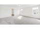 Bright bedroom featuring neutral carpet, white walls, and an open doorway at 13402 E 110Th Way, Commerce City, CO 80022