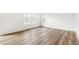 Bright and airy living area showcasing wood flooring and natural light at 13402 E 110Th Way, Commerce City, CO 80022