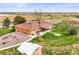Aerial view of a home with a well-maintained yard, shed, and pastoral views, ideal for serene, country living at 12101 Riverdale Rd, Brighton, CO 80602