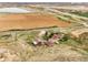 Aerial view of the property and surrounding area, highlighting a farm and nearby highway at 12101 Riverdale Rd, Brighton, CO 80602