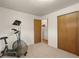 Basement with an exercise bike and storage area at 12101 Riverdale Rd, Brighton, CO 80602