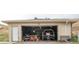 Spacious garage with ample storage and a vehicle inside, perfect for hobbies or parking at 12101 Riverdale Rd, Brighton, CO 80602