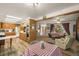 Open concept kitchen and dining area with wood cabinets and plenty of natural light at 12101 Riverdale Rd, Brighton, CO 80602