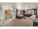 Cozy living room with large windows, comfortable seating, and decor at 12101 Riverdale Rd, Brighton, CO 80602