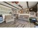 Spacious living room featuring dual couches, wood-look floors, and bright, airy ambiance at 12101 Riverdale Rd, Brighton, CO 80602