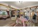 Open floor plan with living and dining area, showcasing comfortable furniture and decor at 12101 Riverdale Rd, Brighton, CO 80602