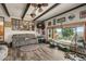 Comfortable living area with beamed ceilings, picture window, and an open floor plan at 12101 Riverdale Rd, Brighton, CO 80602