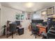 Comfortable office featuring dual workstations, natural light, and functional furnishings, perfect for productivity at 12101 Riverdale Rd, Brighton, CO 80602