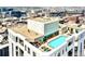 Aerial view of building with rooftop pool and city views at 1625 Larimer St # 2604, Denver, CO 80202