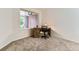 Cozy home office space with a wooden desk, rolling chair and large window offering natural light at 19440 E Mann Creek Dr # E, Parker, CO 80134