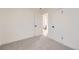 Bright bedroom with grey carpet, white doors, and ample closet space at 1840 S Shoshone St, Denver, CO 80223