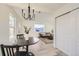 Kitchen features a dining area with a round table and modern chandelier at 1840 S Shoshone St, Denver, CO 80223