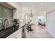 Modern kitchen with stainless steel appliances and dark countertops at 1840 S Shoshone St, Denver, CO 80223