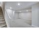 Spacious finished basement with stairs offers recessed lighting and neutral decor at 1418 Hudson Pl, Longmont, CO 80501
