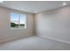 Bedroom with carpet and window at 1418 Hudson Pl, Longmont, CO 80501