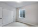 Bedroom with light gray carpet, and closet with white sliding doors at 1418 Hudson Pl, Longmont, CO 80501