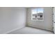 Bedroom featuring a large window and neutral carpet at 1418 Hudson Pl, Longmont, CO 80501