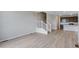 Open living room next to kitchen and stairway at 1418 Hudson Pl, Longmont, CO 80501