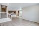 Open living room next to kitchen with view of stairs at 1418 Hudson Pl, Longmont, CO 80501