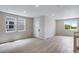 Bright living room with many windows and wood floors at 1418 Hudson Pl, Longmont, CO 80501