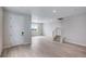 Open living room with view to stairway at 1418 Hudson Pl, Longmont, CO 80501