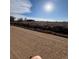 Open land with distant view of mountains and home at 14624 County Road 12, Fort Lupton, CO 80621