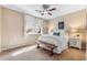 Serene bedroom with bright natural light, neutral decor, and a comfortable bed at 6303 Ellingwood Point Pl, Castle Rock, CO 80108
