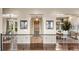 Welcoming entryway with beautiful hardwood floors and views to the formal dining and living areas at 6303 Ellingwood Point Pl, Castle Rock, CO 80108