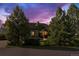 Charming single-Gathering home with mature trees, lush lawn, and beautiful landscaping at 6303 Ellingwood Point Pl, Castle Rock, CO 80108
