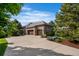 Spacious garage with an expansive driveway and meticulously landscaped surroundings at 6303 Ellingwood Point Pl, Castle Rock, CO 80108