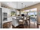 Gourmet kitchen with stainless appliances, granite counters, and a seamless flow into the living space at 6303 Ellingwood Point Pl, Castle Rock, CO 80108