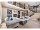 Cozy living room featuring a modern fireplace, comfortable seating, and stylish decor, perfect for relaxation and entertaining at 6303 Ellingwood Point Pl, Castle Rock, CO 80108