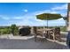 Outdoor deck featuring outdoor dining area, an umbrella, and beautiful scenic views at 6303 Ellingwood Point Pl, Castle Rock, CO 80108